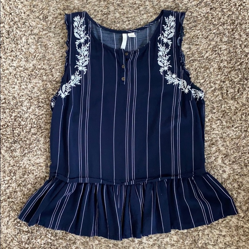 Lauren Conrad striped navy colored peplum tank.